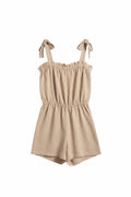 Yanet Collection Shop peach strapless romper with a ruffled neckline, adjustable tie straps, and an elastic waist.