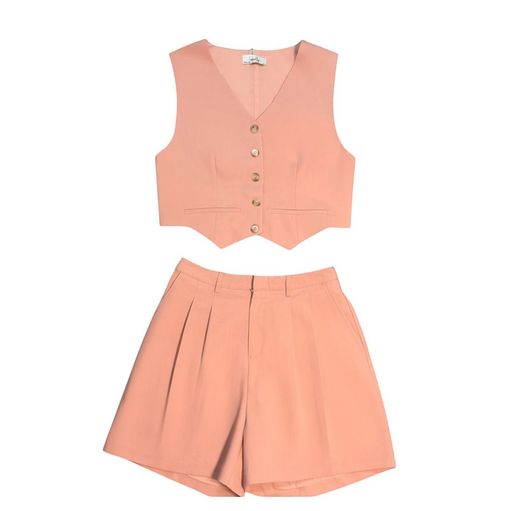 Yanet Collection Shop peach two-piece set featuring a button-up cropped vest and high-waisted pleated shorts.