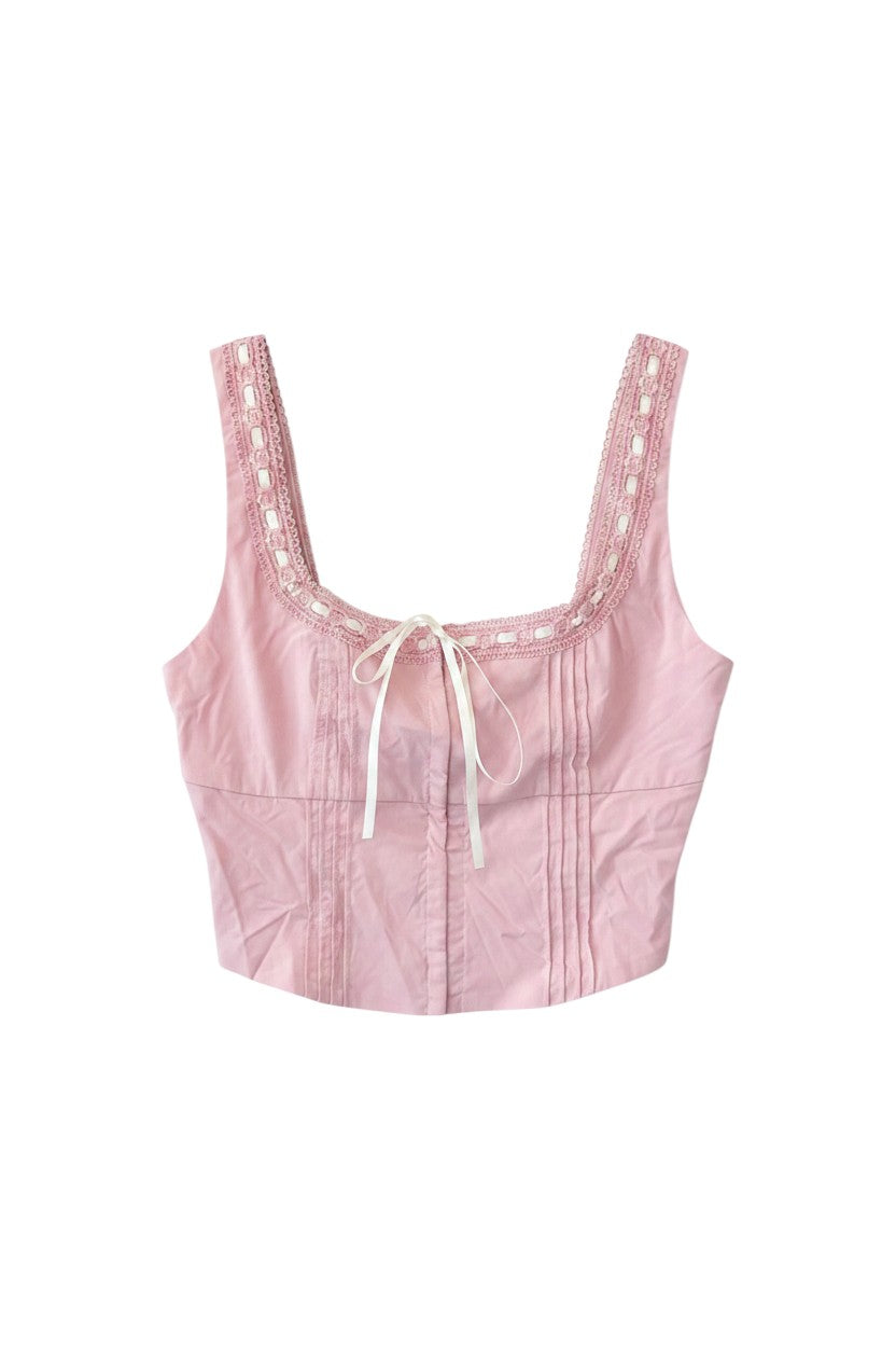 Yanet Collection Shop pink sleeveless crop top with delicate lace trim neckline, pleated front, and white ribbon tie.