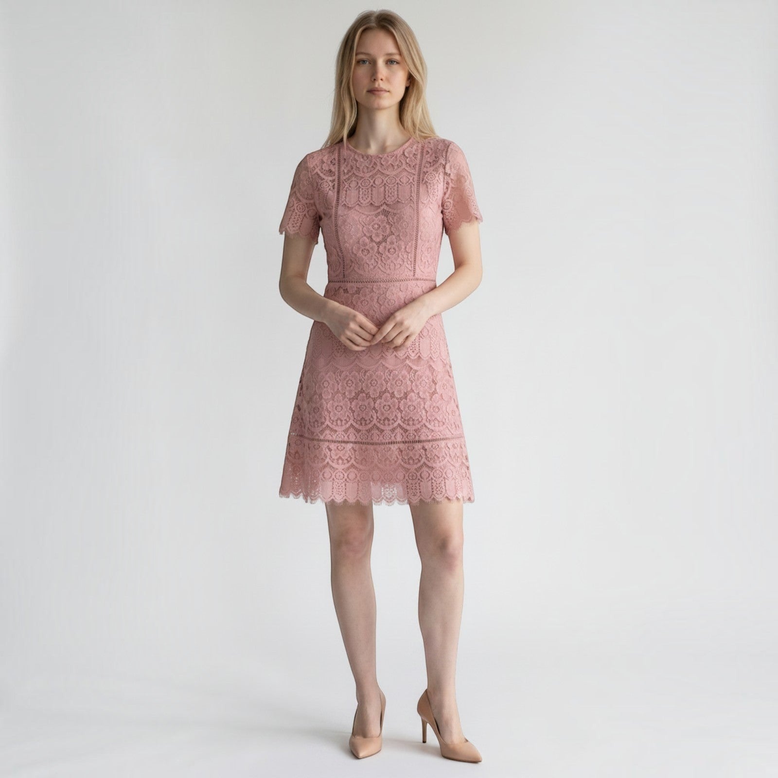 Yanet Collection Shop pink lace knee-length dress with short sleeves and a scalloped hem worn by a blonde model.