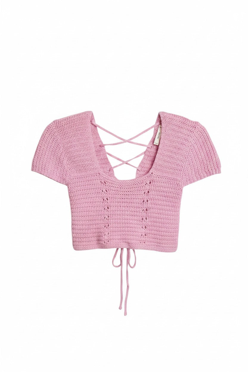 Yanet Collection Shop pink cropped knit top with short sleeves, v-neckline, and lace-up back detail.