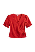 Yanet Collection Shop red wrap top with v-neckline, short ruffle sleeves, and textured floral fabric detail.