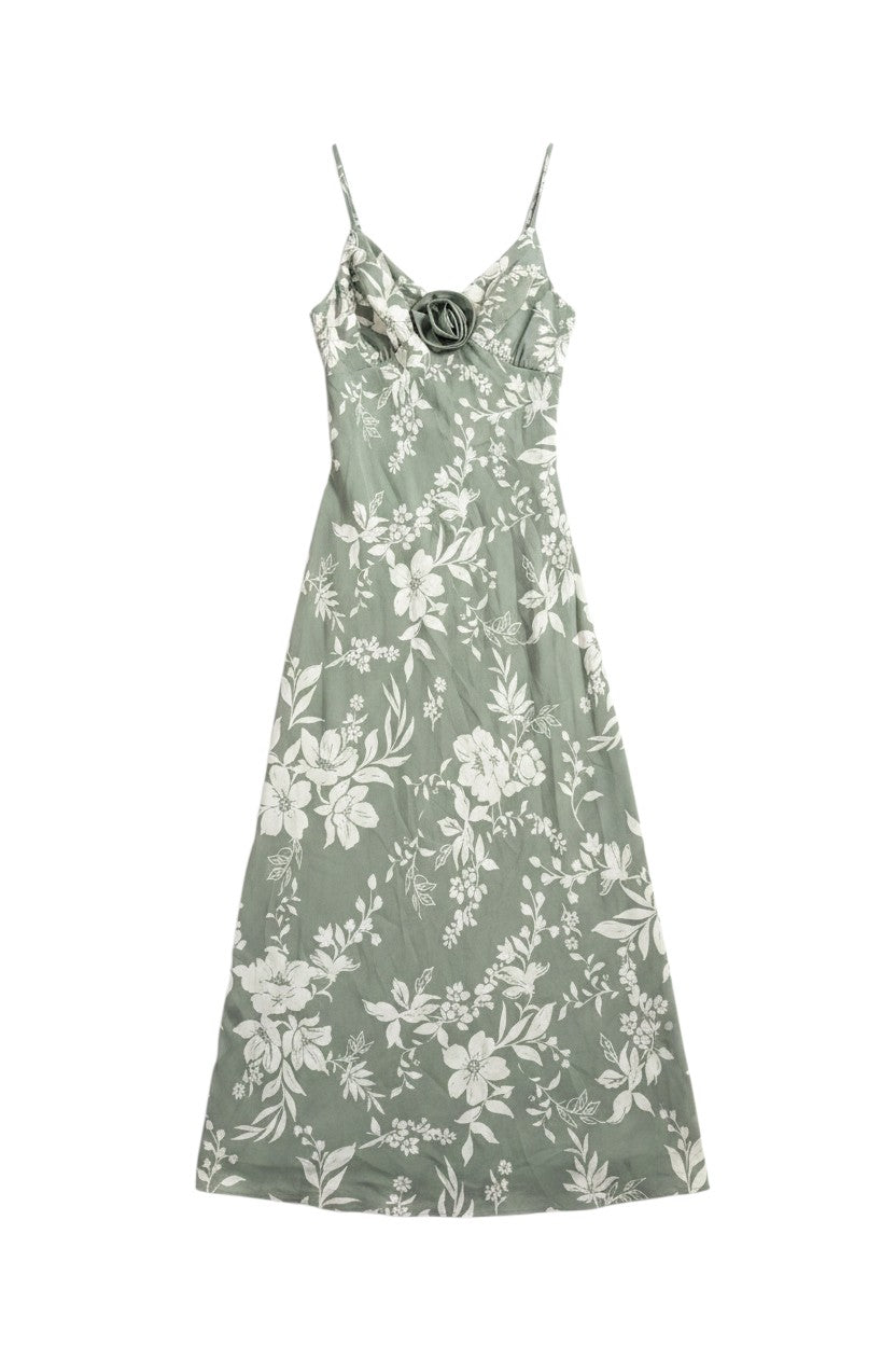 Yanet Collection Shop sage green floral maxi dress with spaghetti straps and a decorative flower detail at the bust.