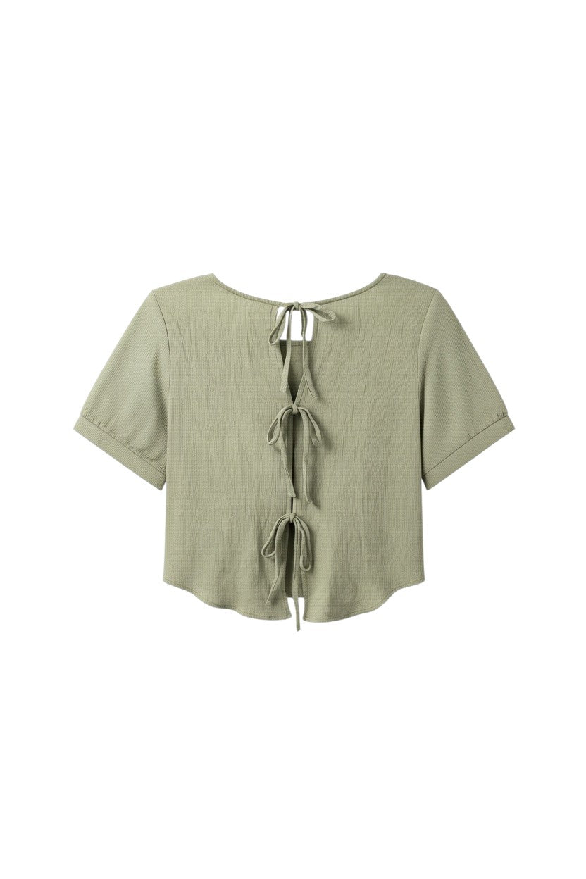 Yanet Collection Shop sage green short sleeve blouse with back tie details and textured fabric in a relaxed fit