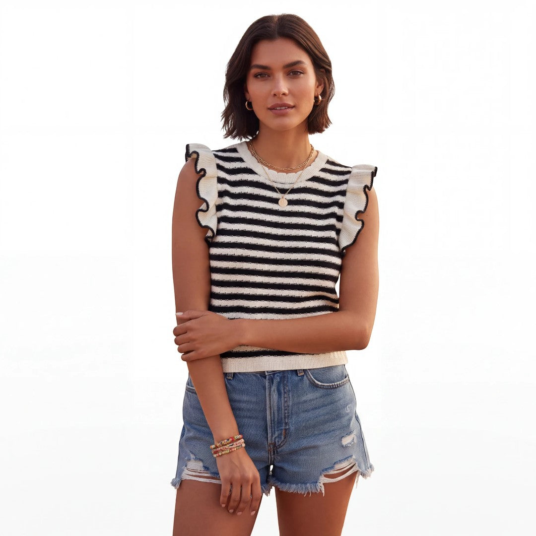Yanet Collection Shop black and white striped knit top with ruffle sleeves worn by a woman with denim shorts
