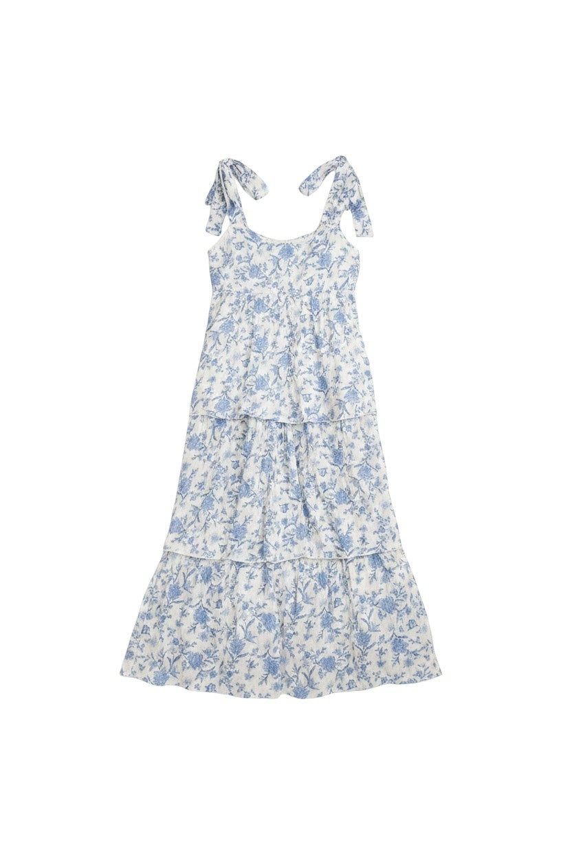 Yanet Collection Shop white tiered midi dress with blue floral print and adjustable bow shoulder straps