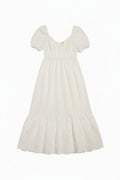 Yanet Collection Shop white maxi dress with puff sleeves, v-neckline, and delicate lace trim hem