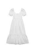 Yanet Collection Shop white maxi dress with puff sleeves, v-neckline, and a tiered ruffle hem in lightweight fabric.