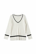 Yanet Collection Shop white ribbed long-sleeve sweater with a v-neckline and contrasting black trim details.