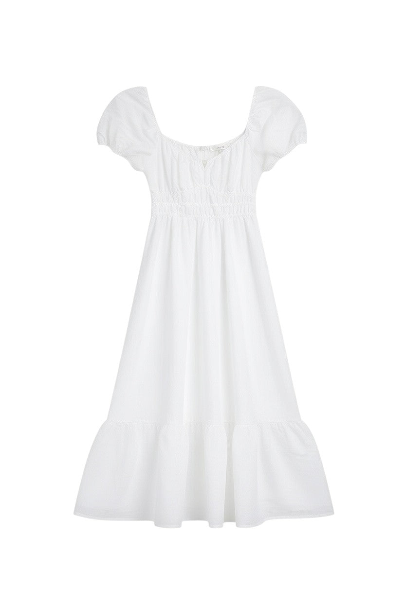 Yanet Collection Shop white maxi dress with short puff sleeves, a smocked bodice, and a playful ruffled hem.