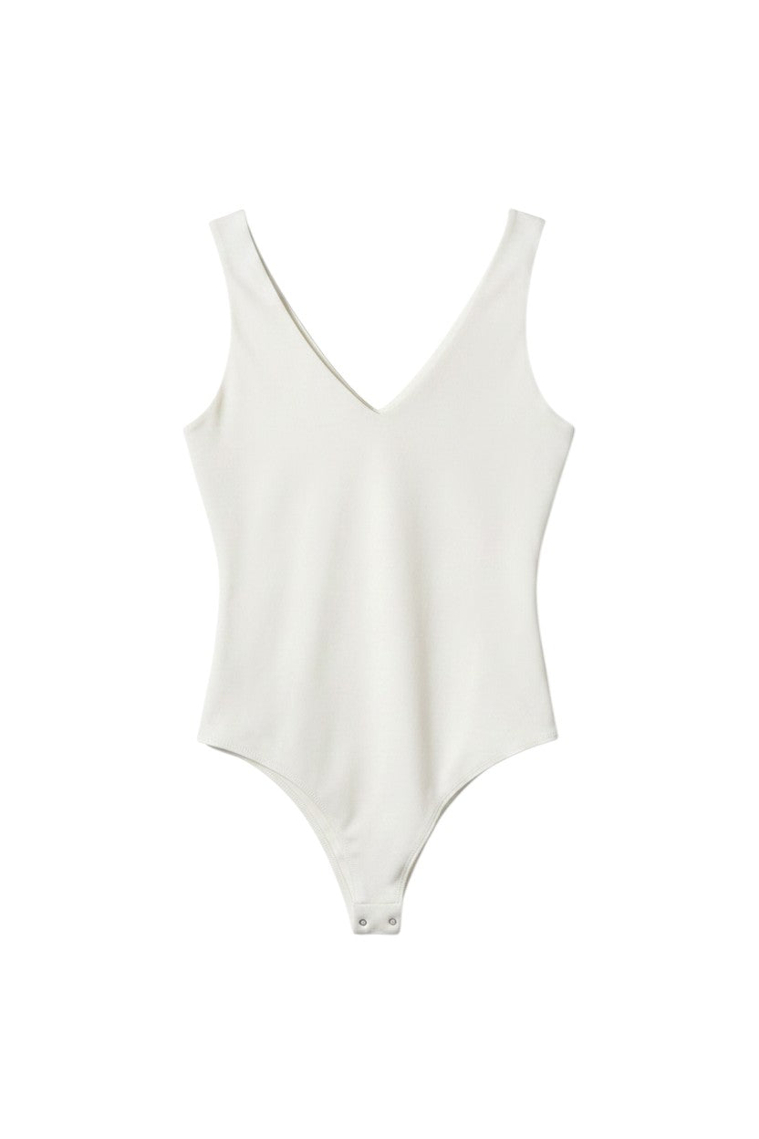 Yanet Collection Shop white sleeveless v-neck bodysuit with a fitted silhouette and snap closure