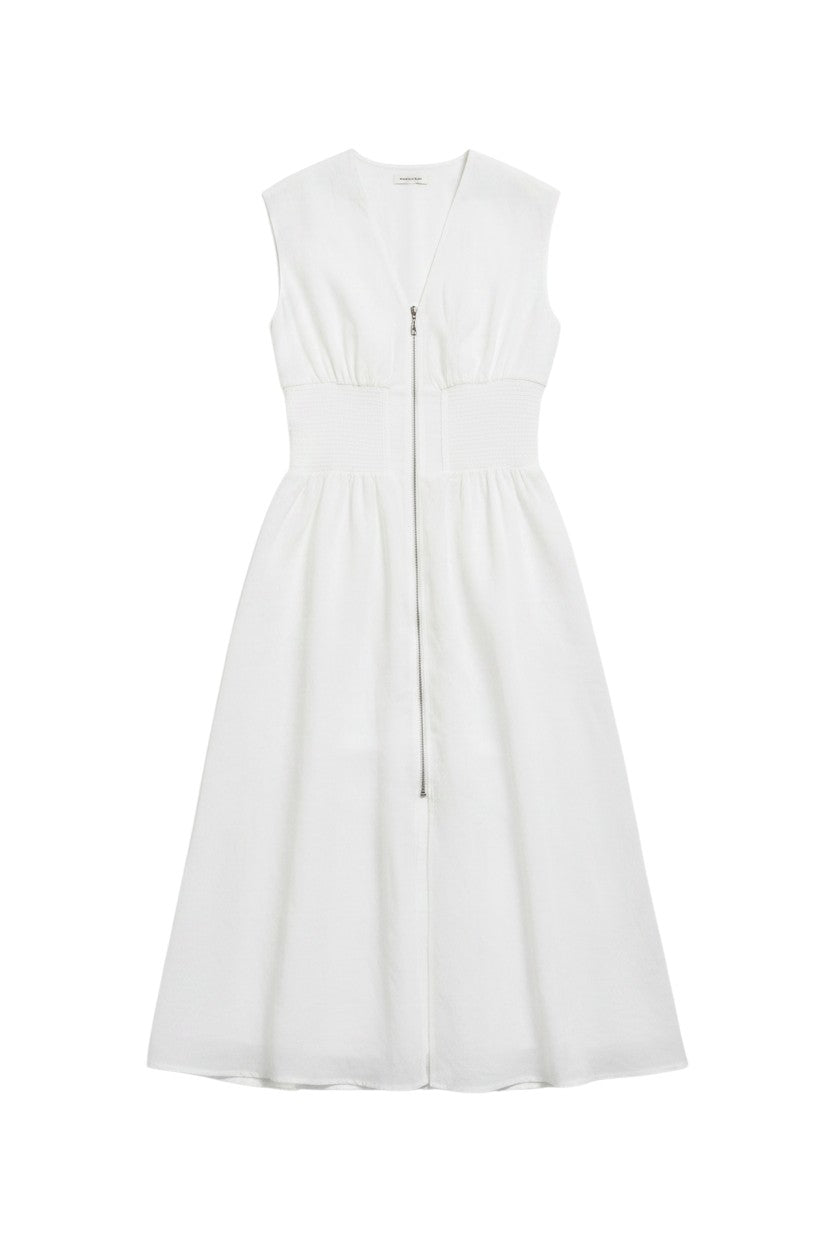 Yanet Collection Shop white sleeveless maxi dress with a cinched waist and front zipper detail in a flowy silhouette.